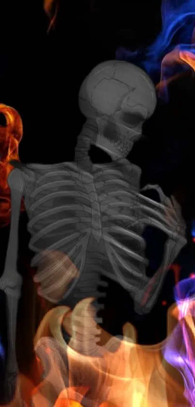 Skeleton surrounded by vivid blue and orange flames on a black background.