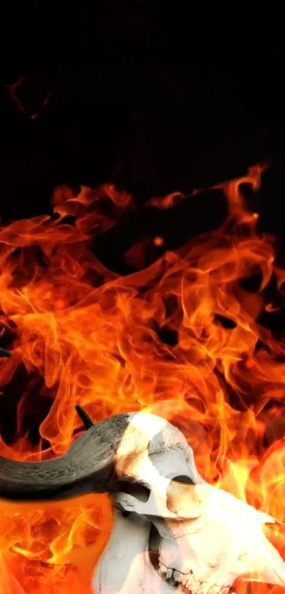 Skull amidst fiery flames on a dark background mobile wallpaper.