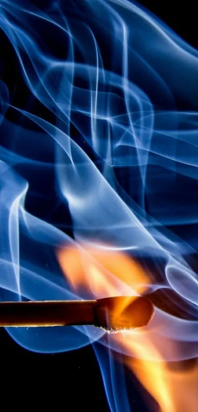 Matchstick igniting with blue smoke and orange flame background.