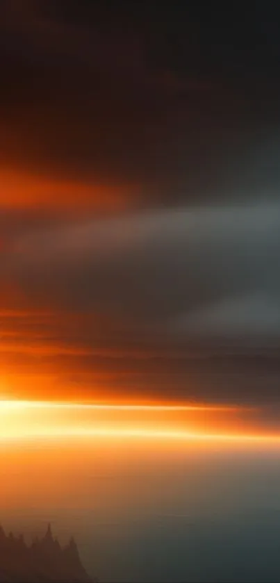 Fiery sunset landscape with vibrant orange and dark clouds over a serene horizon.