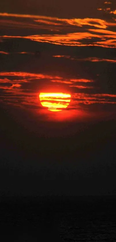 Fiery sunset with deep orange hues in the evening sky.