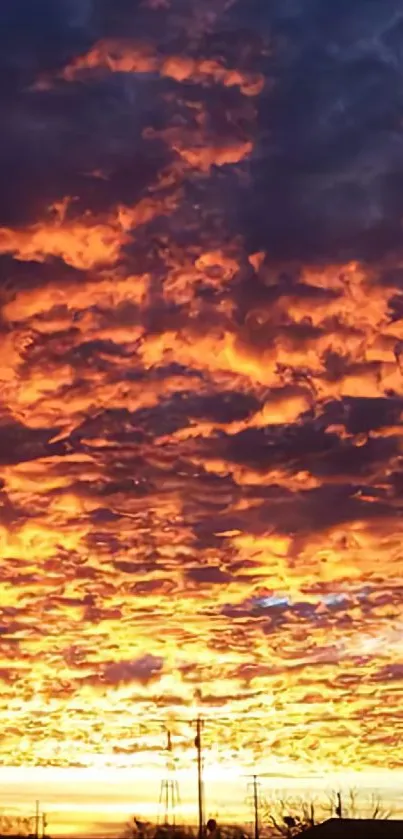 Orange and purple sunset sky with dramatic clouds.