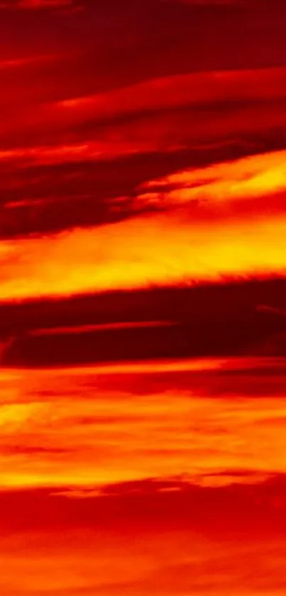 Fiery sunset sky wallpaper with shades of orange and red.