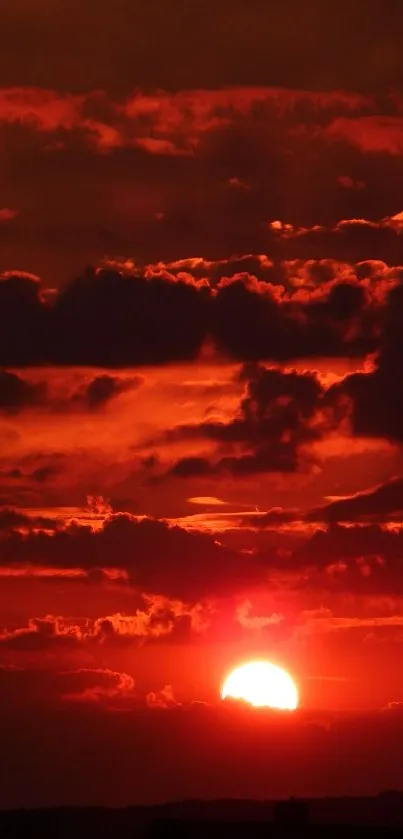 Stunning fiery sunset with red sky and clouds.