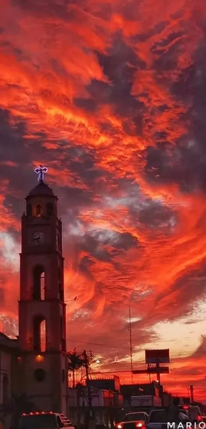 Vibrant red and orange sunset over city skyline.