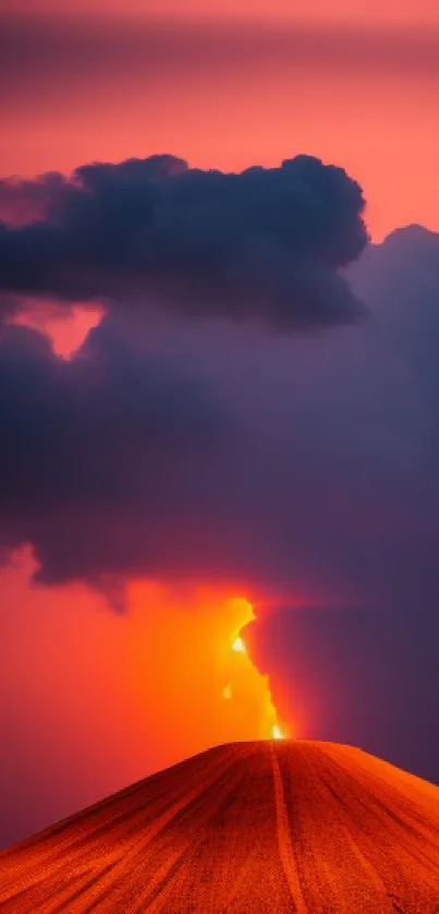 Volcano silhouetted against a fiery sunset sky with vibrant orange hues.