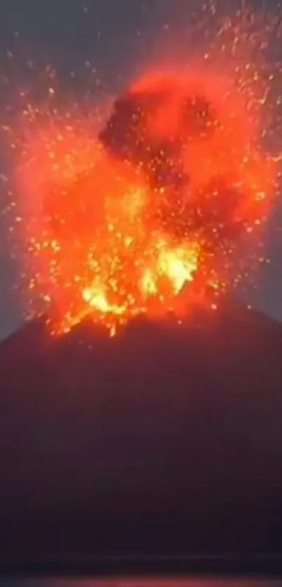 Volcano eruption with fiery lava against the night sky.