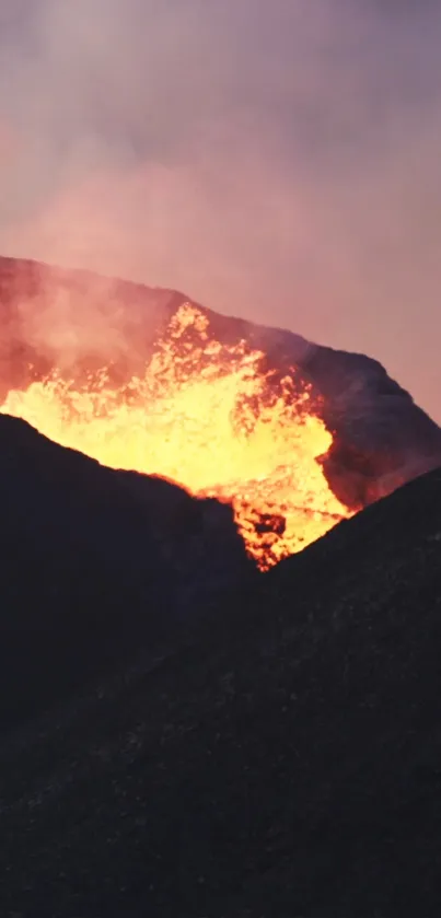 Fiery volcanic eruption with glowing lava and dark foreground silhouette.