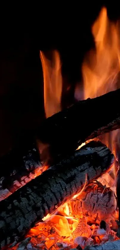 Mobile wallpaper of vibrant orange flames and logs.