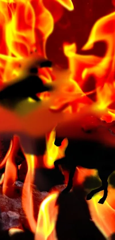 Silhouetted wolves with fiery, orange background on wallpaper.