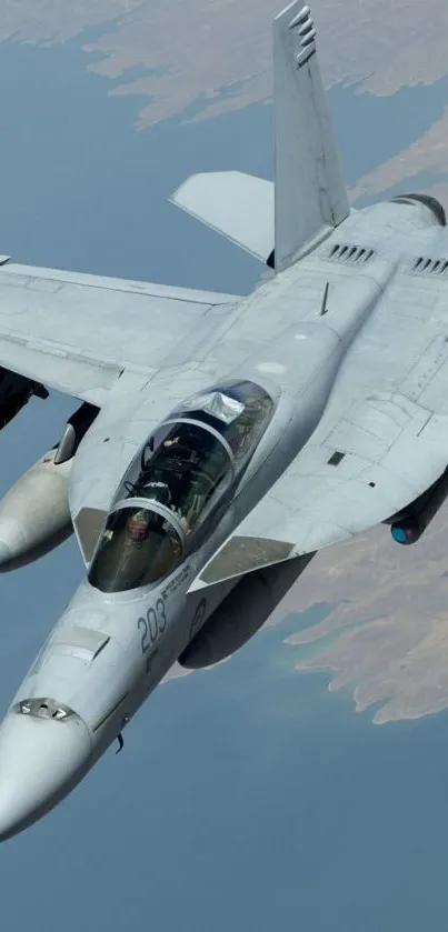 High-flying fighter jet above the ocean.