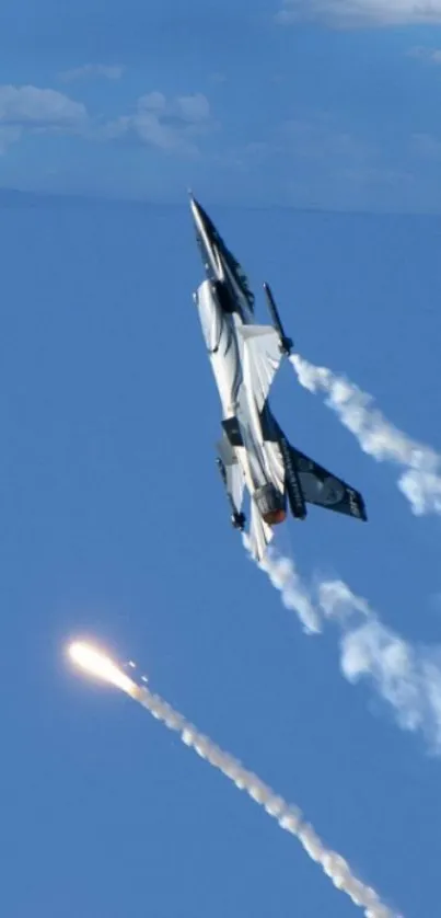 Fighter jet in clear blue sky with vapor trails.