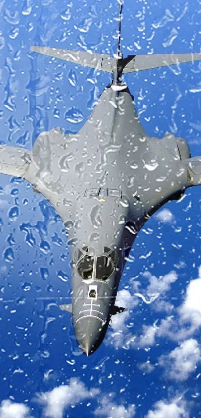 Fighter jet soaring above scattered clouds in a vivid blue sky.
