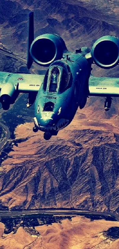 Fighter jet soaring over a vast desert landscape with mountains.