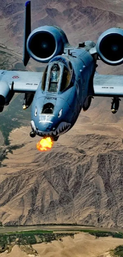 Fighter jet flying over a vast desert landscape.