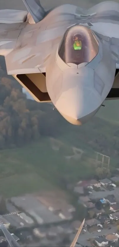 Fighter jet flying over scenic landscape at high altitude.