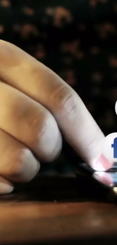 Hand touching smartphone screen with social media icons.