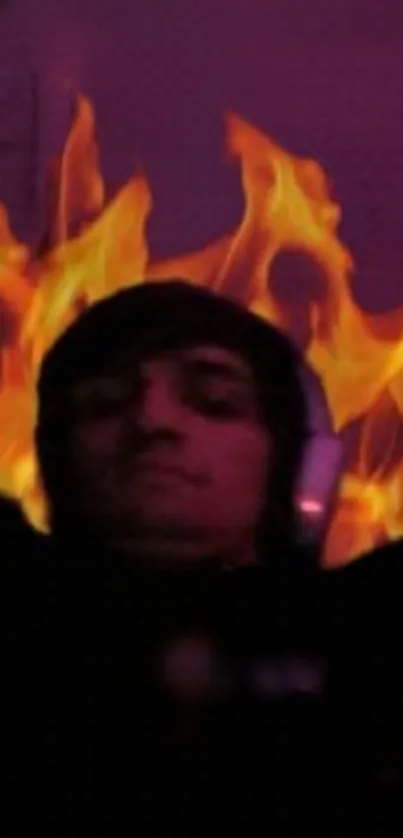 Person with headphones surrounded by flames.