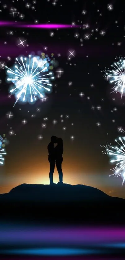 Silhouette of a couple with fireworks in a night sky.