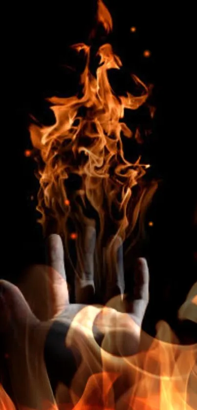 Hand engulfed in flames against a dark background, perfect for a fiery mobile wallpaper.