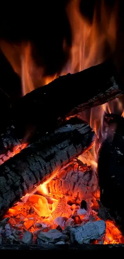 Vibrant mobile wallpaper of flaming logs with glowing embers.