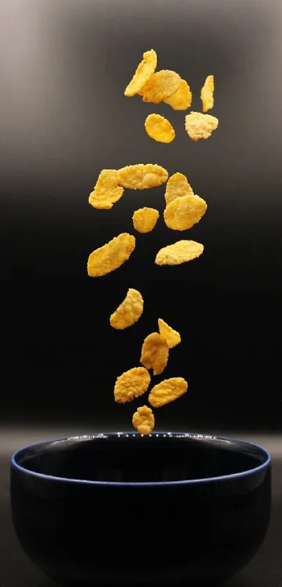 Floating cornflakes above a blue bowl on a dark background.