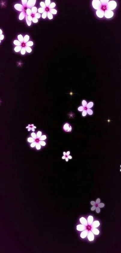 Glowing pink floral design on dark background.