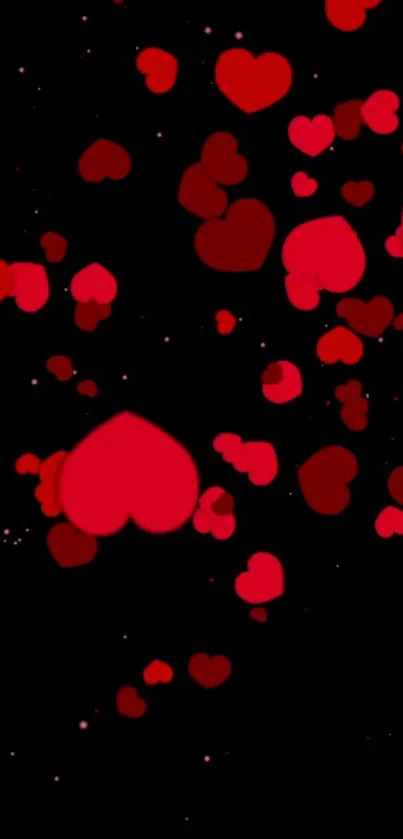 Mobile wallpaper with red hearts on a black background.