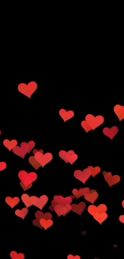 Floating red hearts on black background wallpaper.