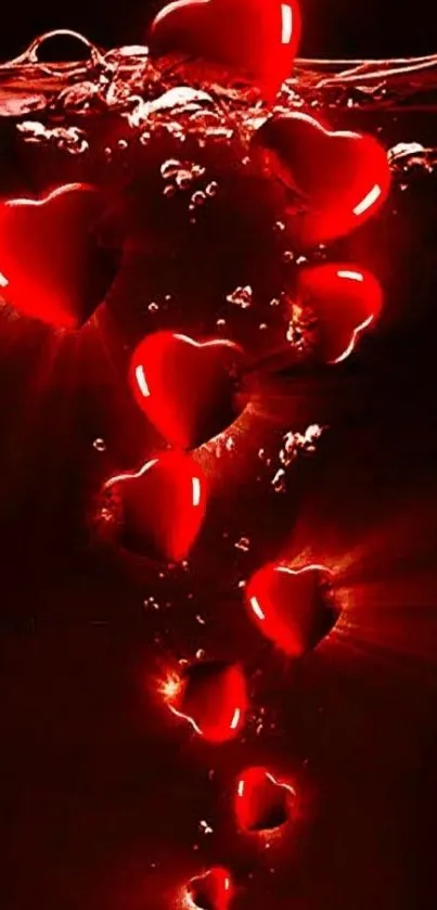 Red hearts floating underwater in a dark background, creating a romantic scene.