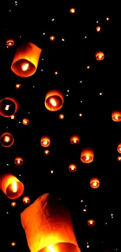 Floating lanterns illuminate the night sky in a stunning display.