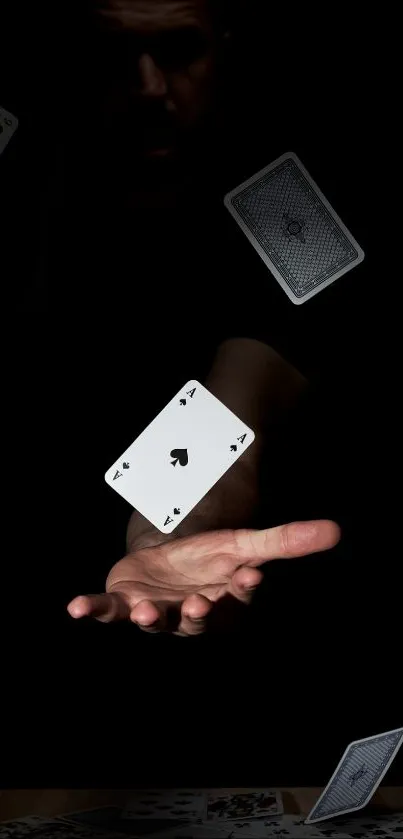 Black-themed wallpaper with floating playing cards creating a magical illusion.