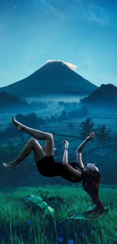 Floating woman over fields with mountain backdrop at night.