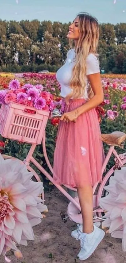 Woman in pink skirt with bike in flower field.