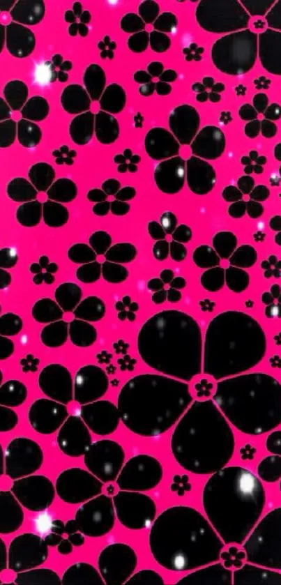 Vibrant floral wallpaper with black flowers on a pink background.