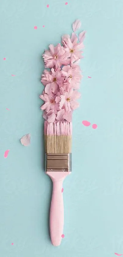 Paintbrush with pink cherry blossoms on a sky-blue background.