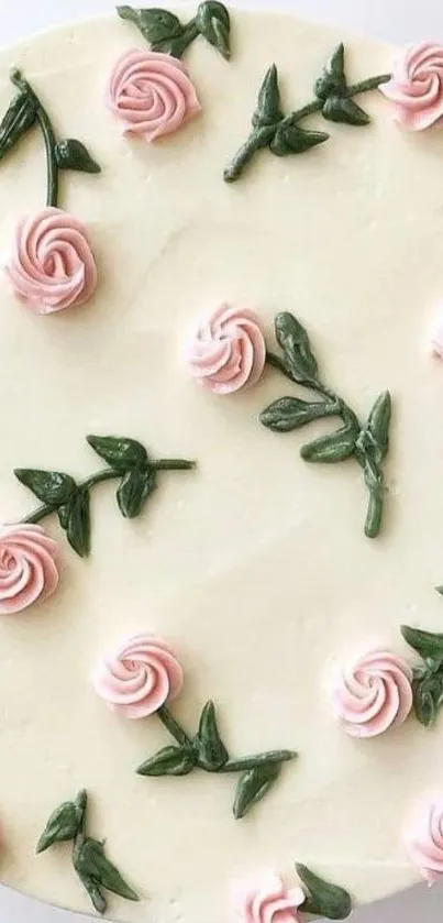 Ivory cake with pink roses and green leaves design.