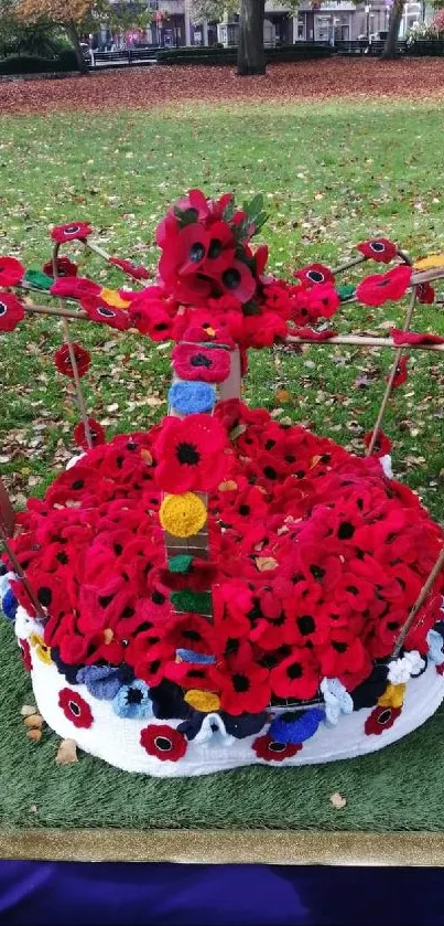 Floral crown centerpiece in park, surrounded by autumn foliage.