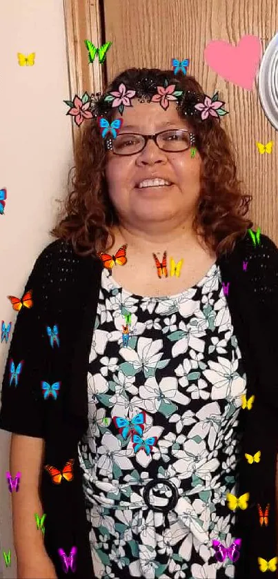 Smiling woman in a floral dress with decor.