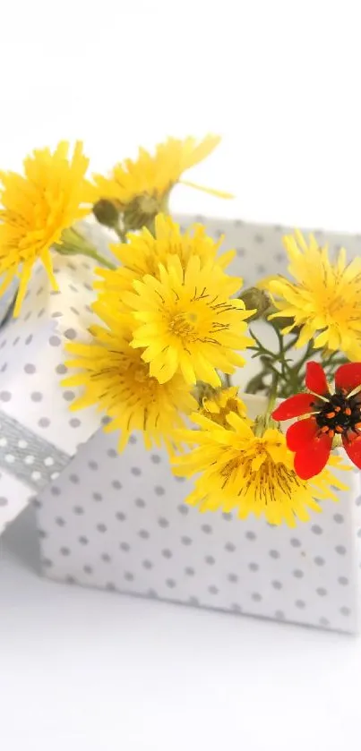 Open gift box with yellow and red flowers in a polka dot design.