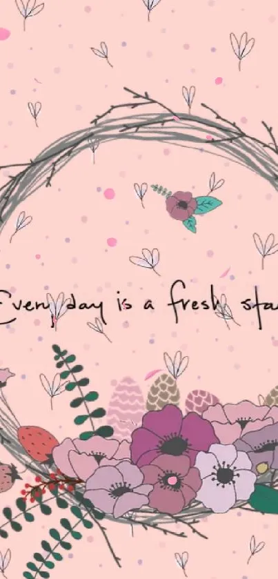 Floral wreath with motivational quote on a light pink background.