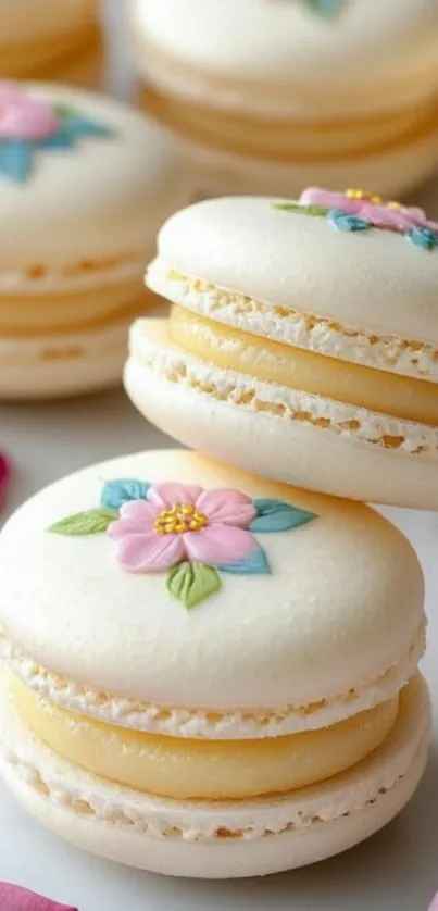Elegant floral macarons with pastel colors on display.