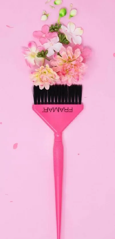 Pink brush with floral arrangement on pink background.