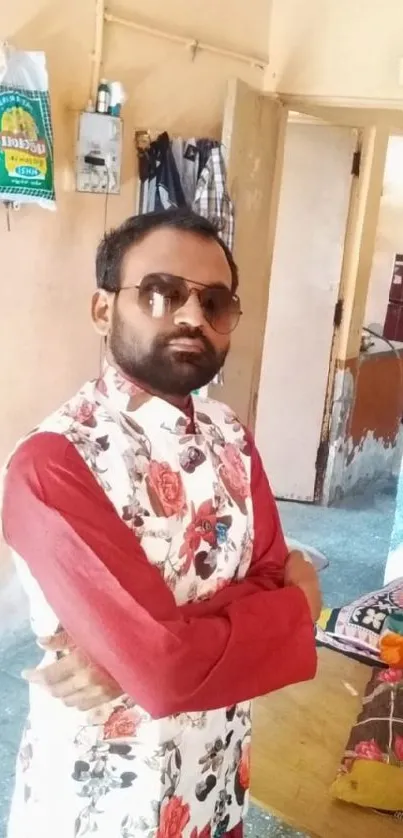 Man wearing floral vest in colorful room.