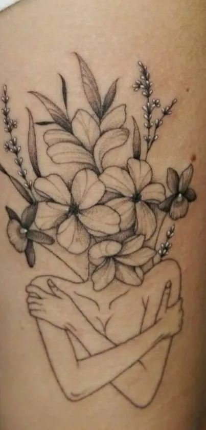 Elegant black and white floral tattoo design on skin.