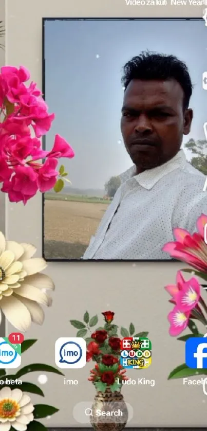 Floral wallpaper with a central portrait image and vibrant pink flowers.