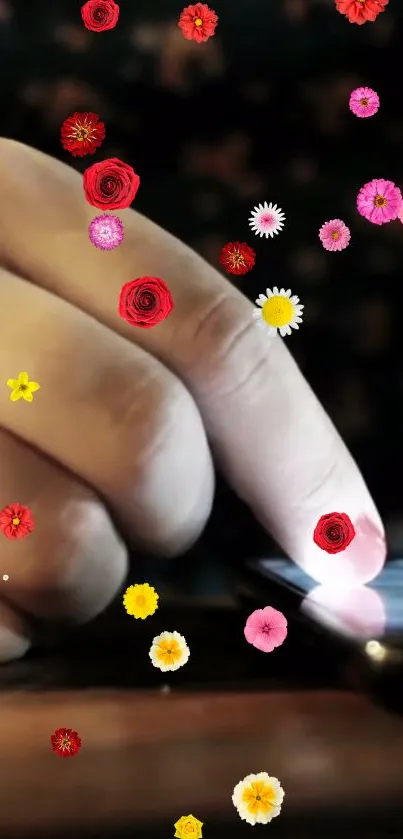 Hand touching a screen with colorful floral effects.