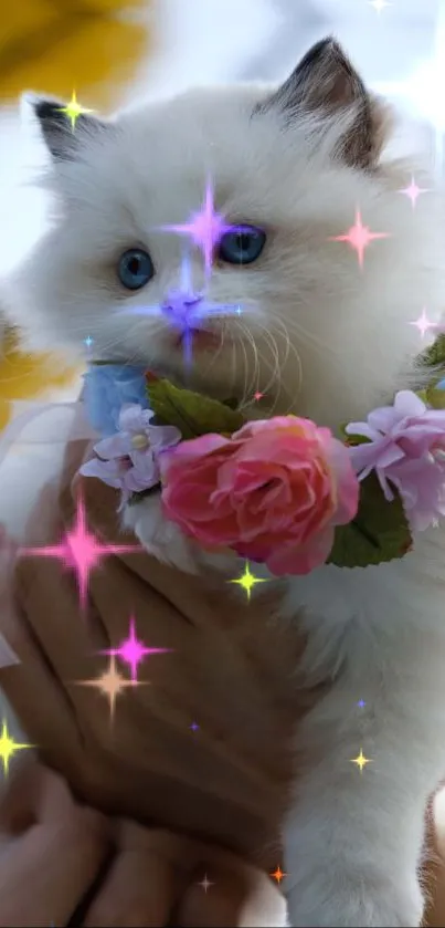 Fluffy white kitten with floral crown and sparkling stars.