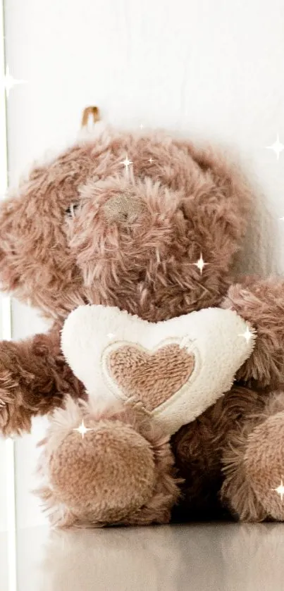 Fluffy teddy bear holding a heart, perfect for mobile wallpaper.