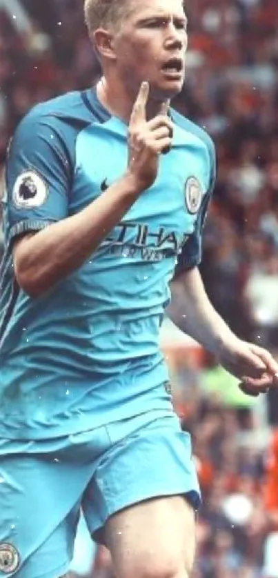 Football player celebrating on field with blue jersey.